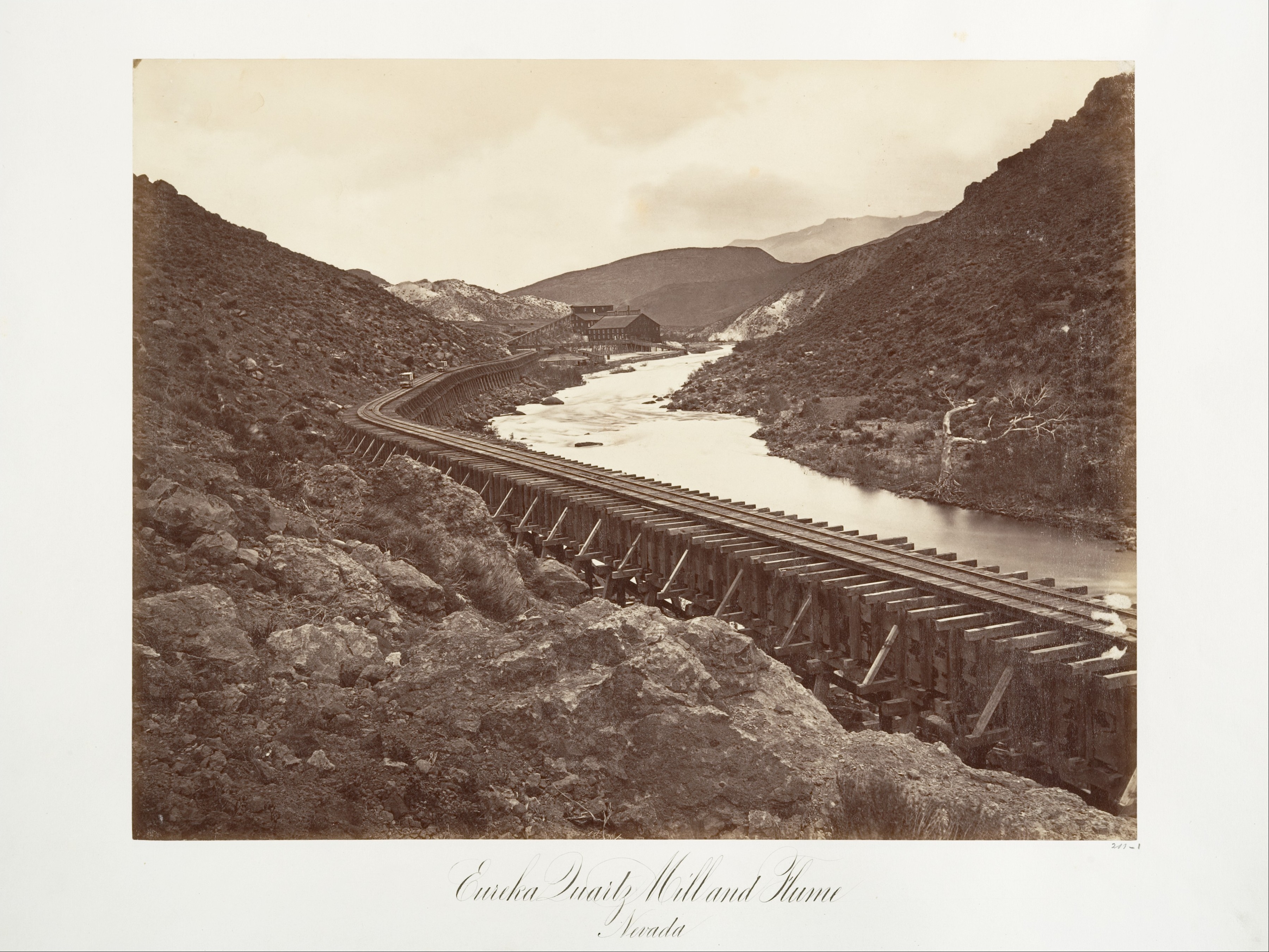 Timber flume and industrial quartz mill in a Nevada canyon at Eureka
